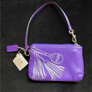 Coach Vibrant Purple Wristlet with Tassel Design